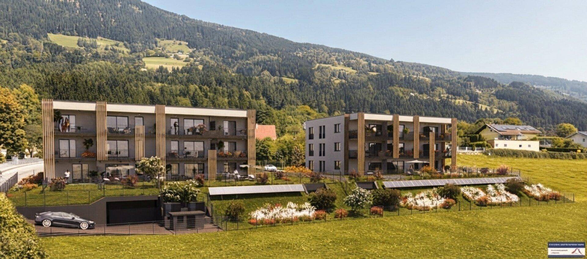 Moderne Wohngebäude in ländlicher Umgebung mit Bergblick und Solaranlagen auf einer Wiese.