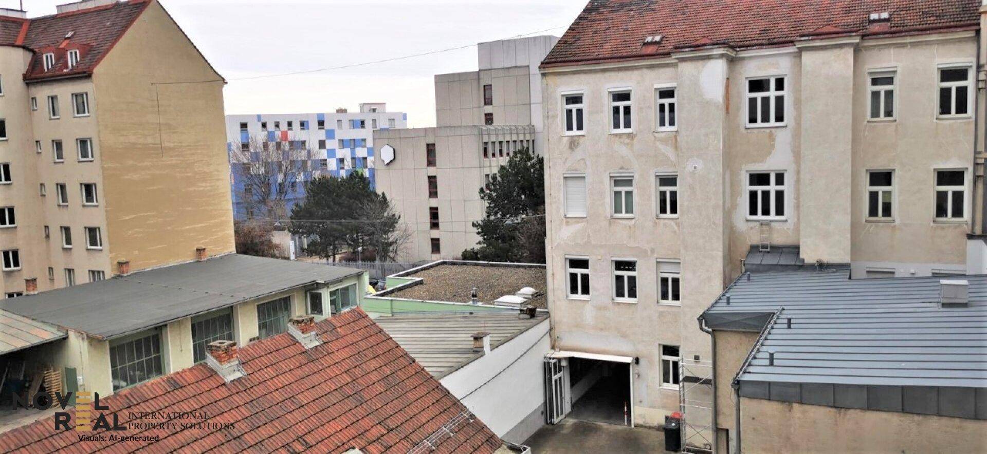 Blick auf die umliegenden Gebäude und Dächer in einer städtischen Umgebung.