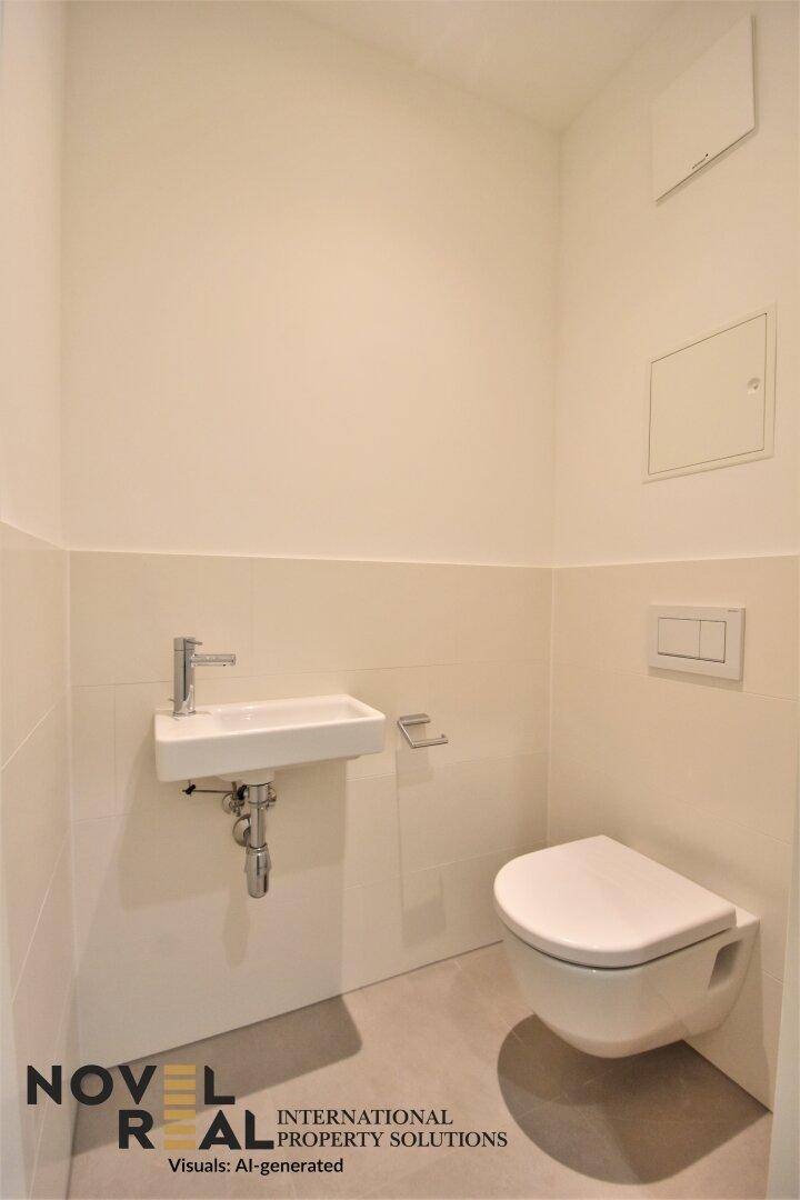 Kleines Gäste-WC mit wandhängender Toilette und modernem Waschbecken.