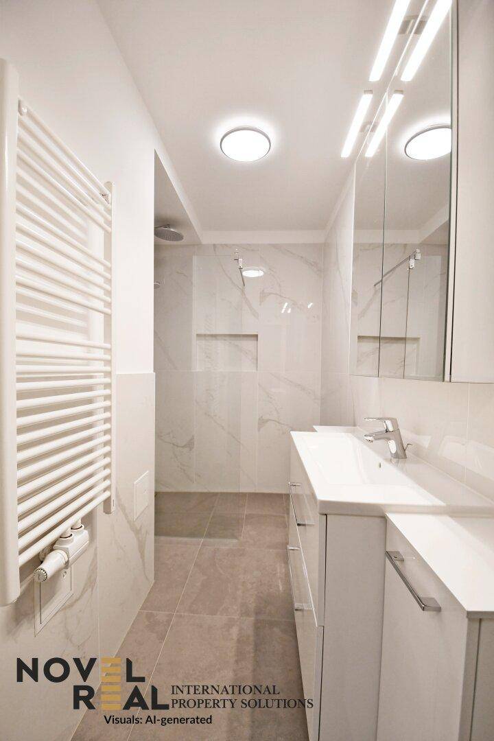 Modernes Badezimmer mit begehbarer Dusche, Waschtisch und beheiztem Handtuchhalter.