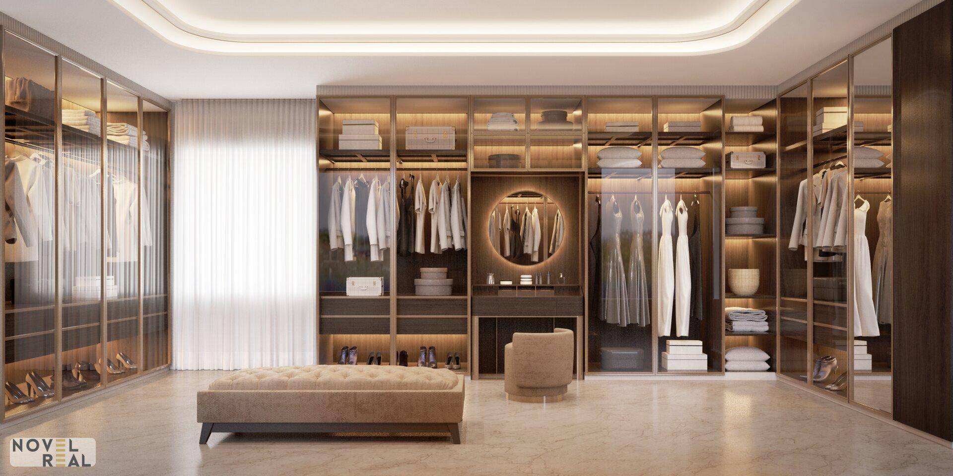 Geräumiger begehbarer Kleiderschrank mit eleganten Glasfronten und integrierter Sitzbank.