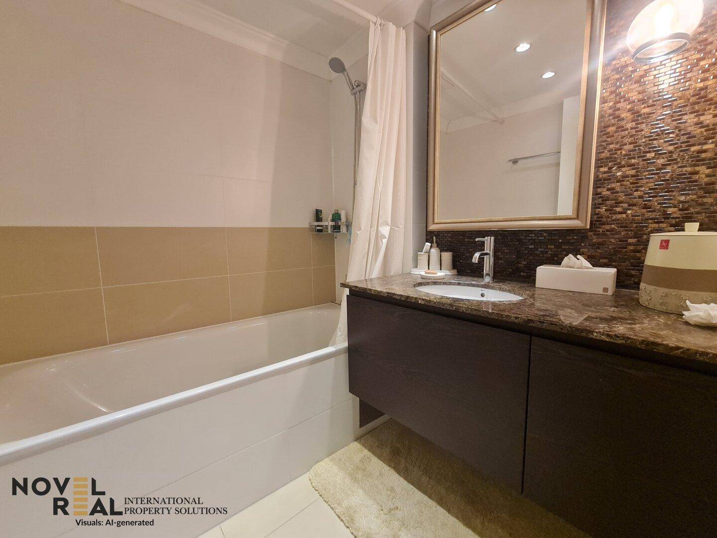 Modernes Badezimmer mit Badewanne, Waschtisch und eleganten Fliesen.