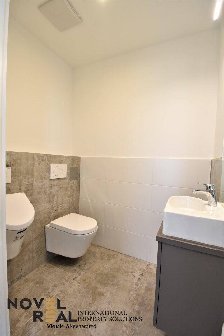 Gäste-WC mit wandhängender Toilette und modernem Waschbecken.