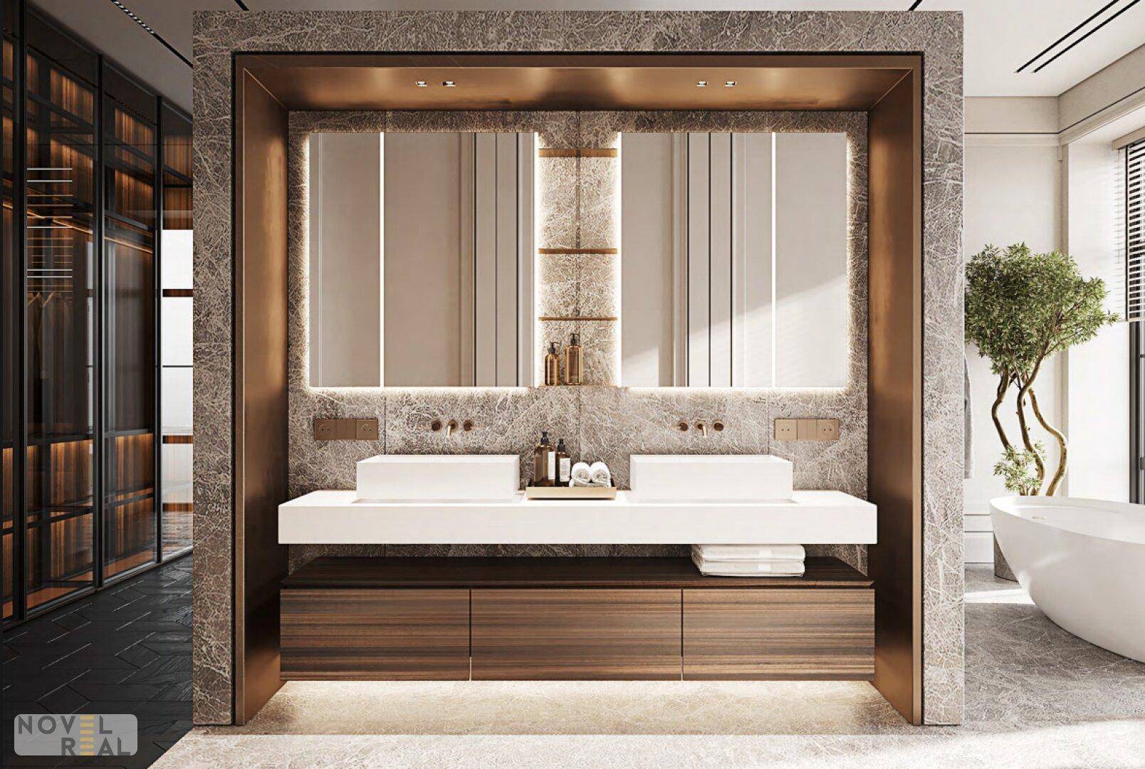 Modernes Badezimmer mit Doppelwaschbecken, integrierter Beleuchtung und angrenzendem Ankleidezimmer.