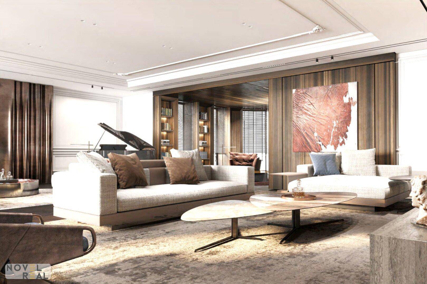 Großzügiges Wohnzimmer mit bequemen Sofas, modernem Couchtisch und Flügel im Hintergrund.