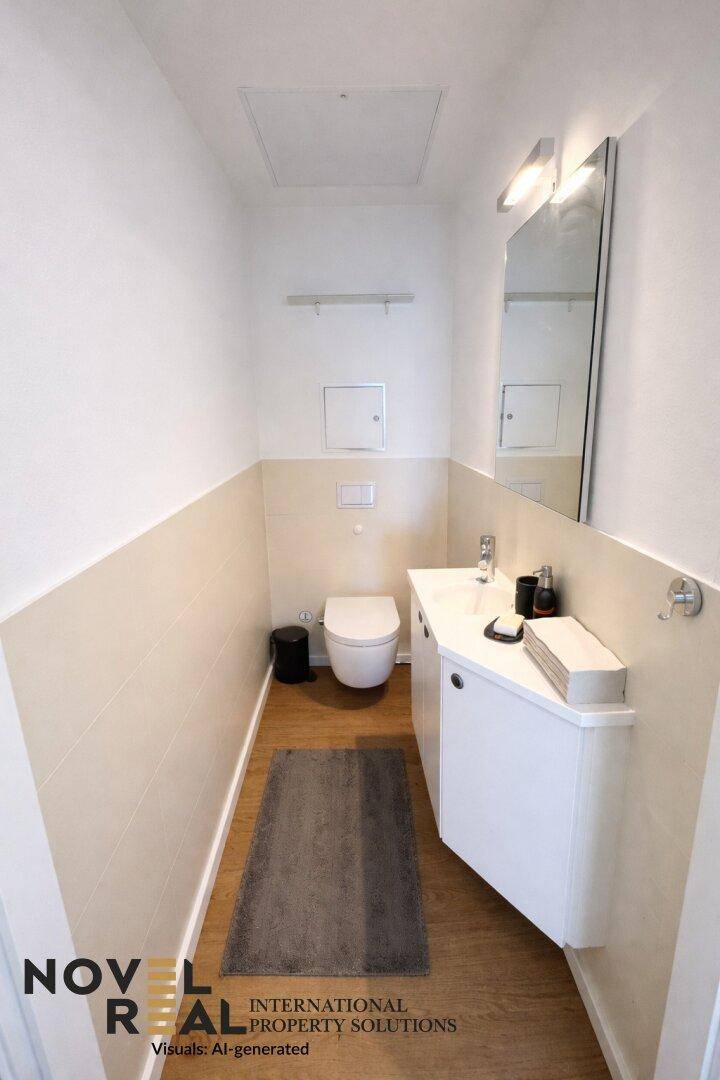 Modernes Gäste-WC mit wandhängender Toilette, Waschbecken und hellem Holzboden.