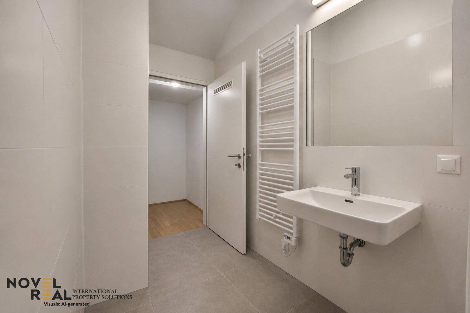 Modernes Badezimmer mit Fliesenboden, Waschbecken und beheiztem Handtuchhalter.