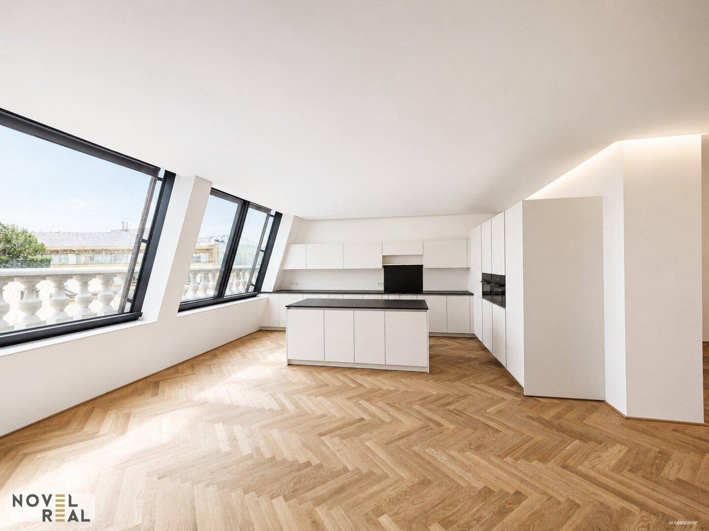 Moderne, offene Küche mit weißer Kücheninsel, integrierten Geräten und großen Fenstern.