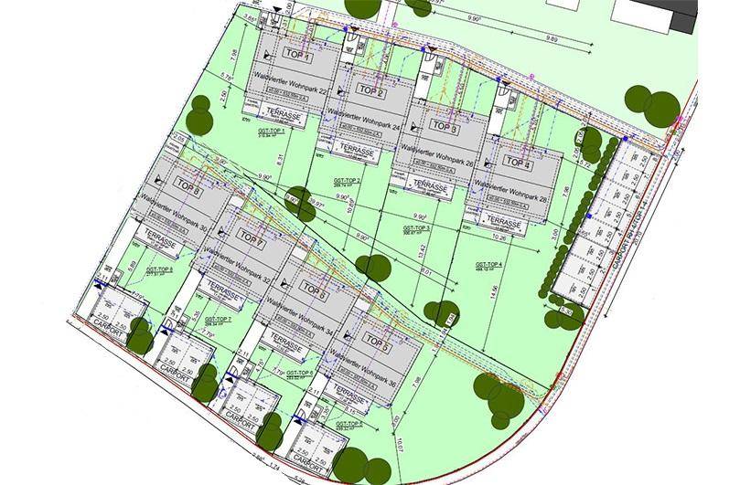 Übersichtsplan des Wohnparks mit mehreren Reihenhäusern, Terrassen und Carports.