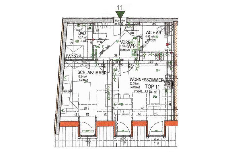 Grundriss einer Dachgeschosswohnung mit Schlafzimmer, Wohnzimmer und Bad.