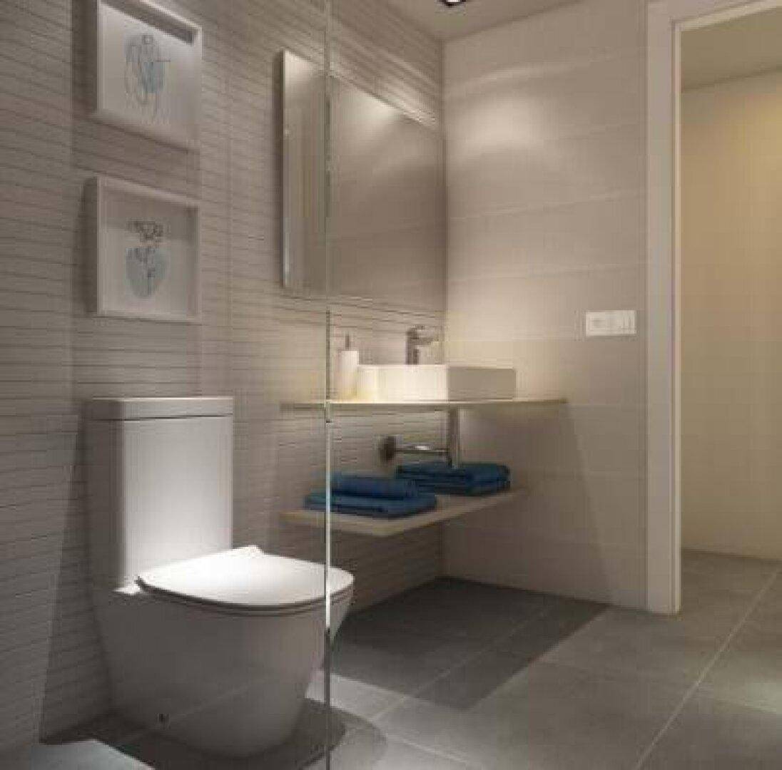 Modernes WC mit wandmontierter Toilette, Einzelwaschbecken und hellen Fliesen, minimalistisches Design.