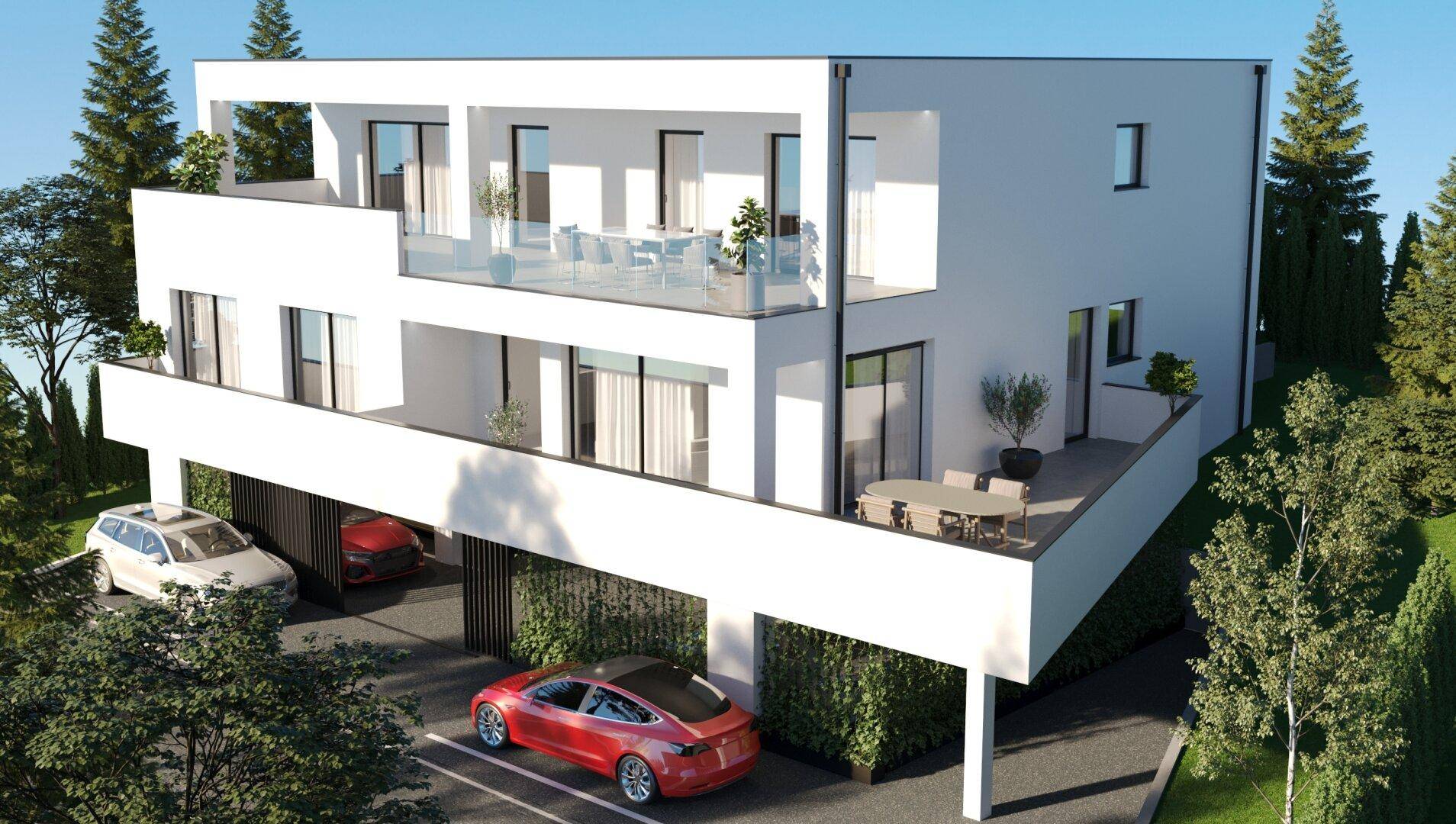 Modernes Mehrfamilienhaus mit mehreren Balkonen, weißer Fassade und überdachten Parkplätzen.