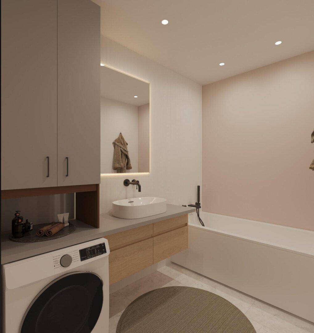 Modernes Badezimmer mit Badewanne, Einzelwaschbecken und integrierter Waschmaschine.