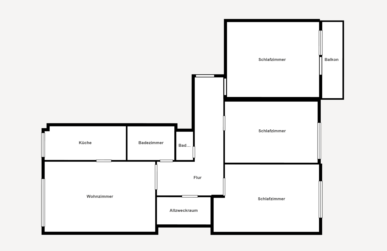 Klarer Grundriss der Wohnung mit Schlafzimmern, Wohnzimmer und Balkon.