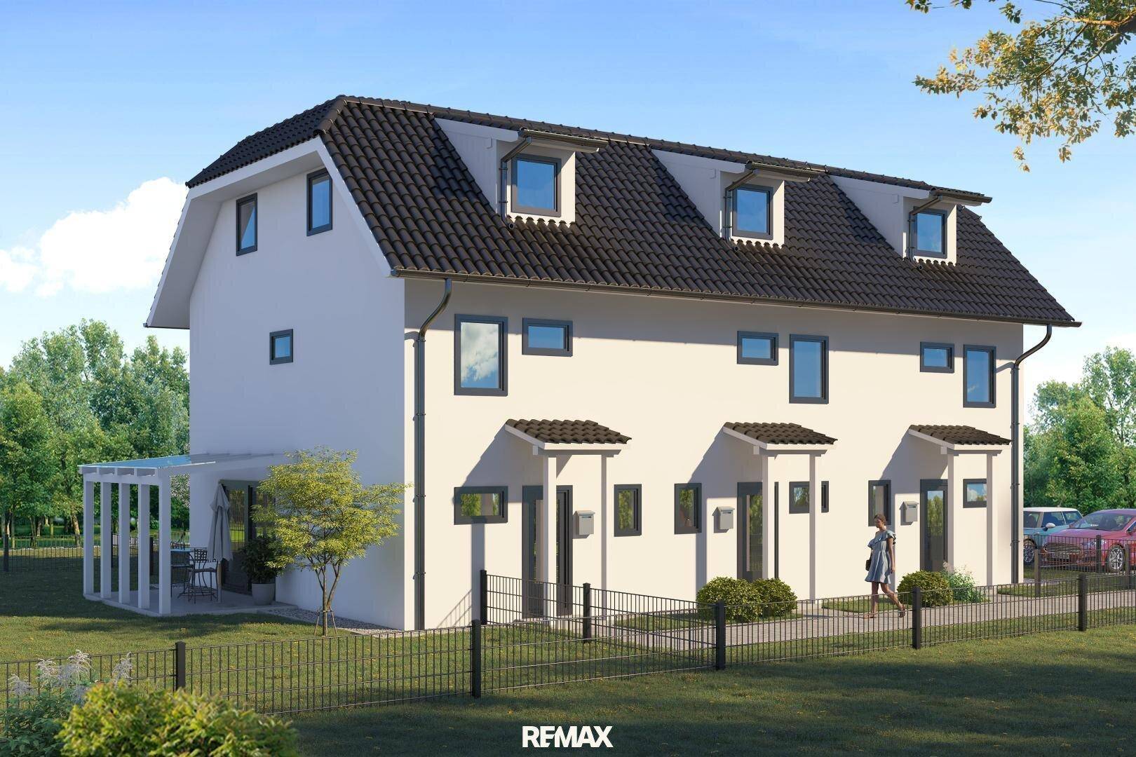 Ansicht einer modernen Doppelhaushälfte mit weißer Fassade und gepflegtem Vorgartenbereich.