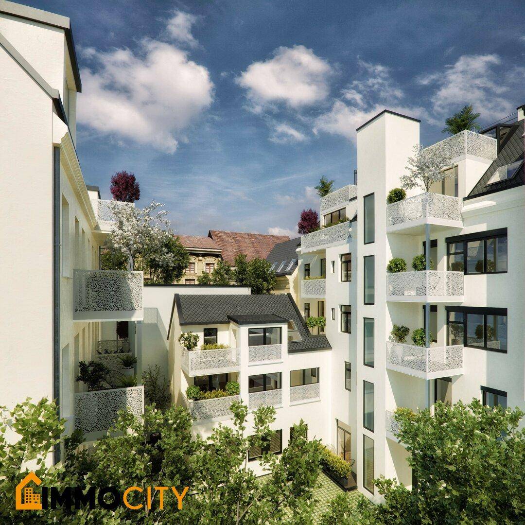 Moderne Wohnanlage mit mehreren Balkonen und begrünten Außenbereichen unter blauem Himmel.