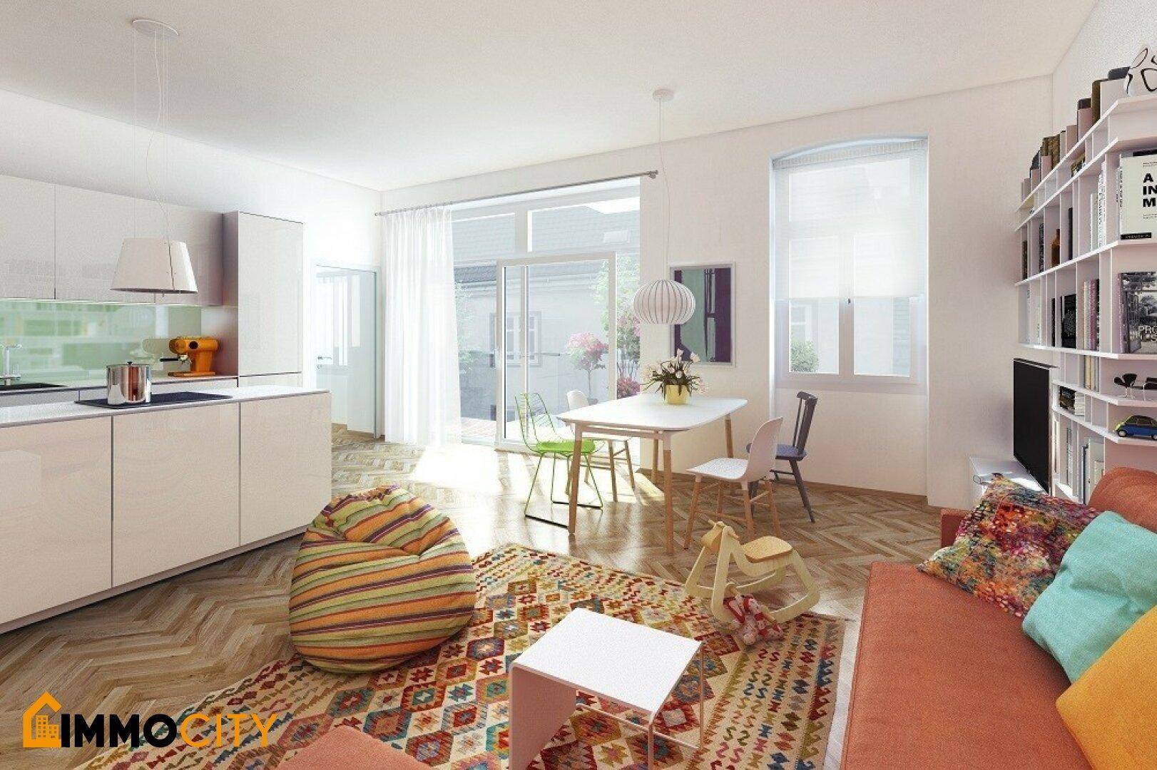 Helles, offenes Wohnzimmer mit integrierter Küche, Essbereich und Zugang zum Balkon.