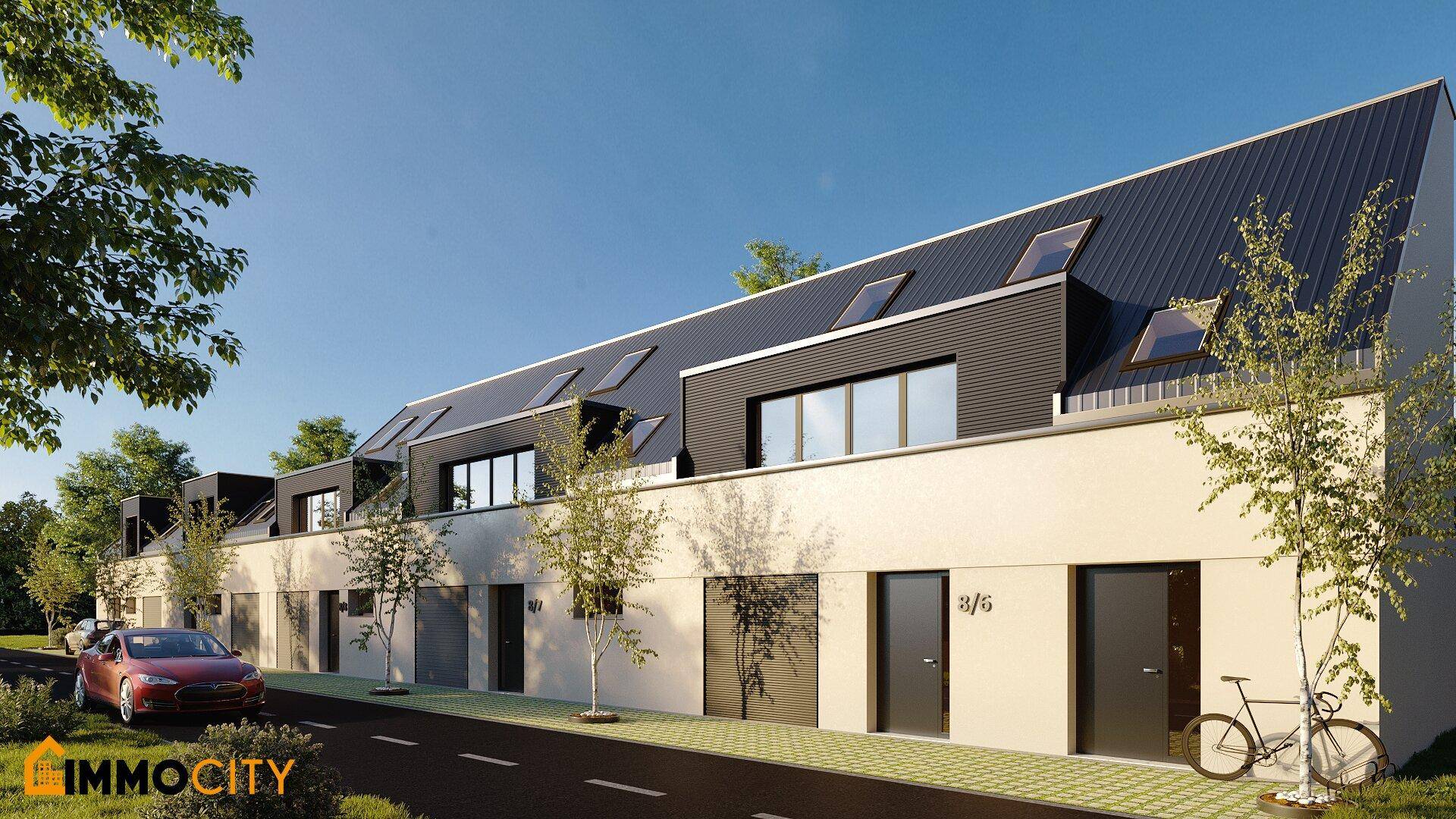 Reihenhäuser mit moderner Architektur, Satteldach und Dachfenstern an einer ruhigen Straße.