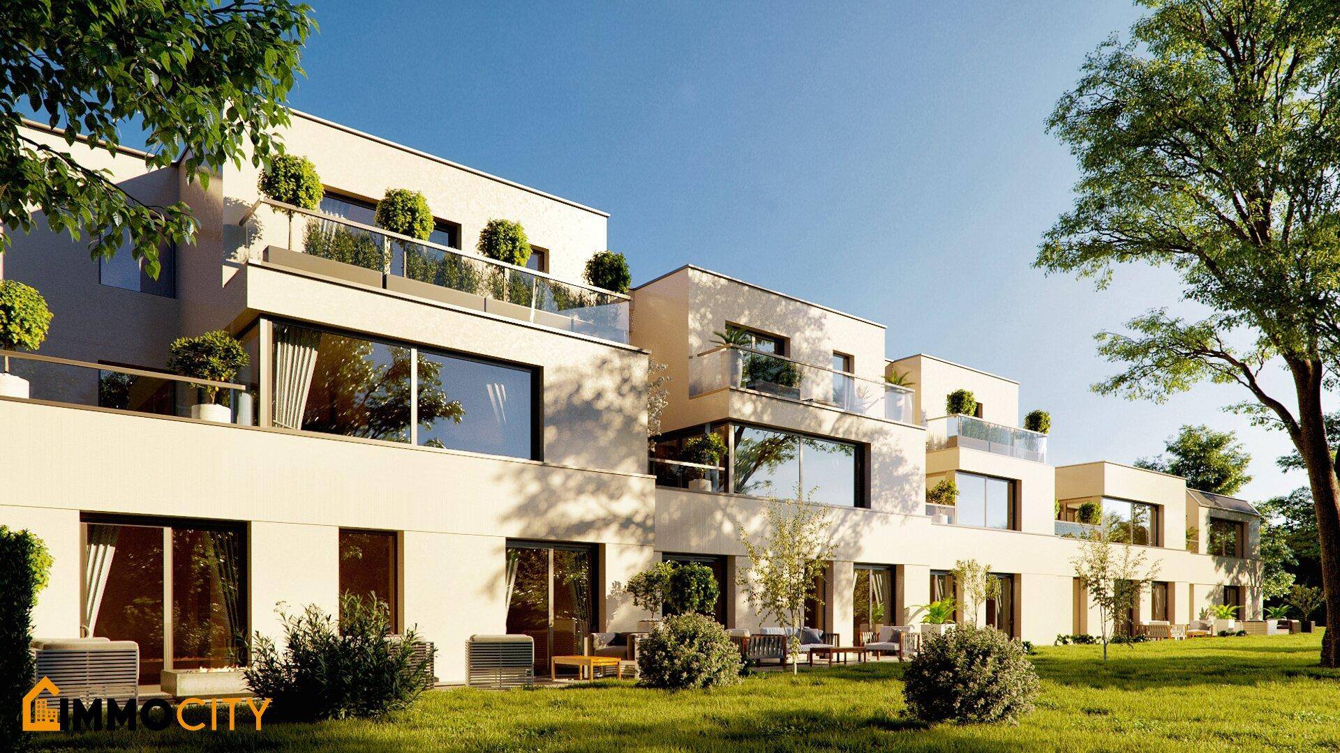Moderne Architektur mit gestuften Terrassen und Balkonen, umgeben von Grünflächen.