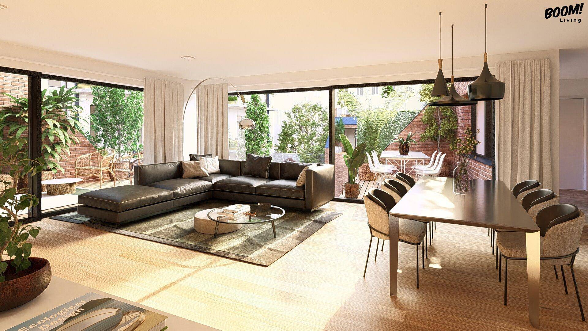 Heller, offener Wohn-Essbereich mit Holzboden, bequemer Couch und Zugang zur Terrasse.