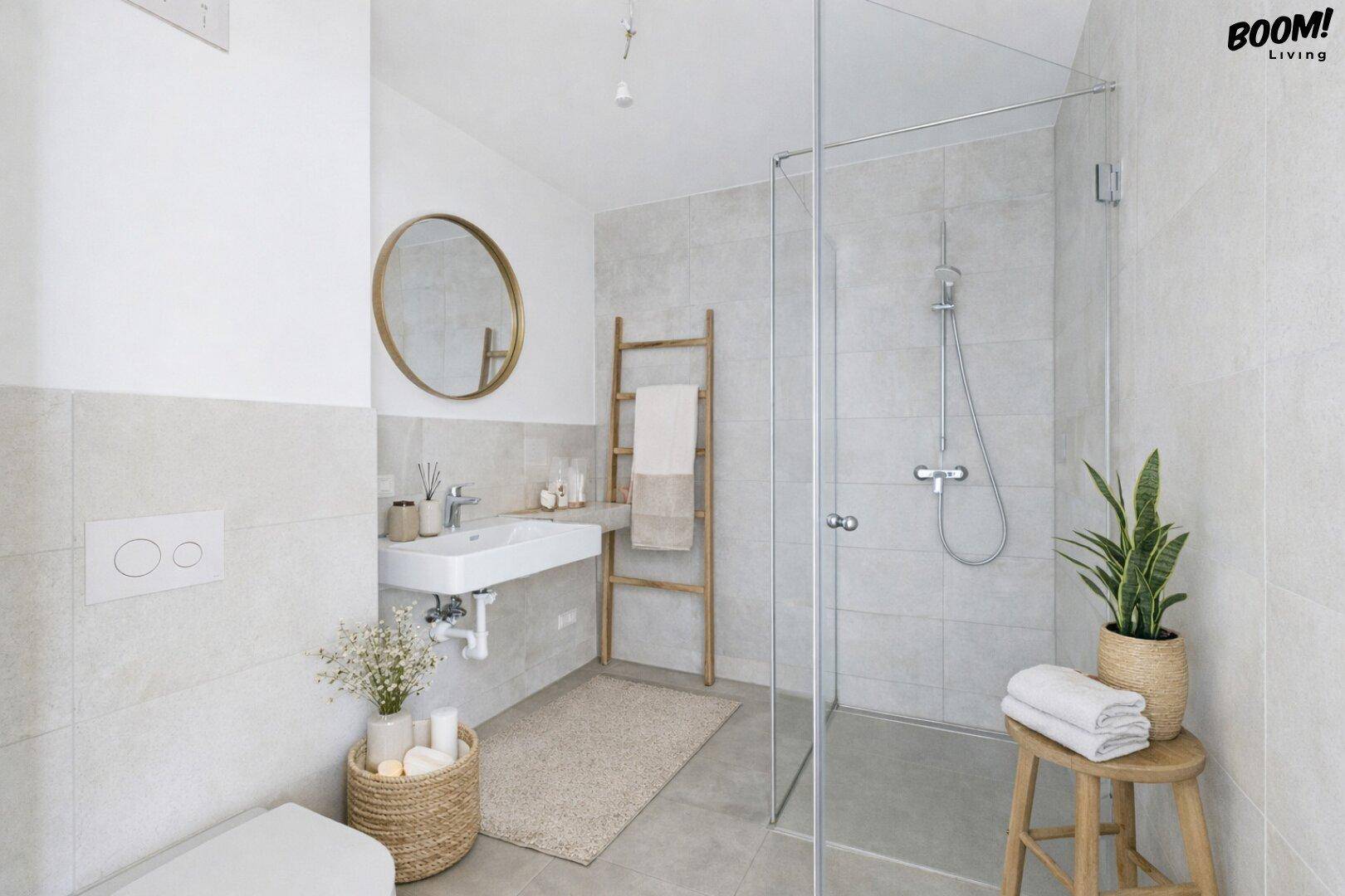 Modernes Badezimmer mit begehbarer Dusche, Wand-WC und stilvollem runden Spiegel.
