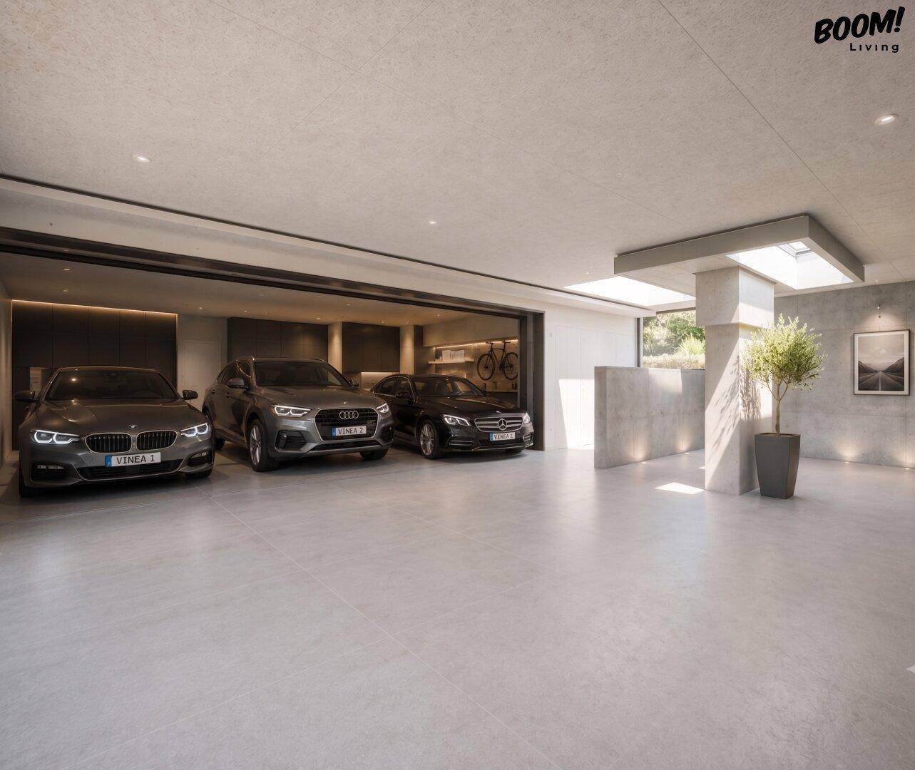 Geräumige Tiefgarage mit Platz für mehrere Fahrzeuge und moderner Beleuchtung.