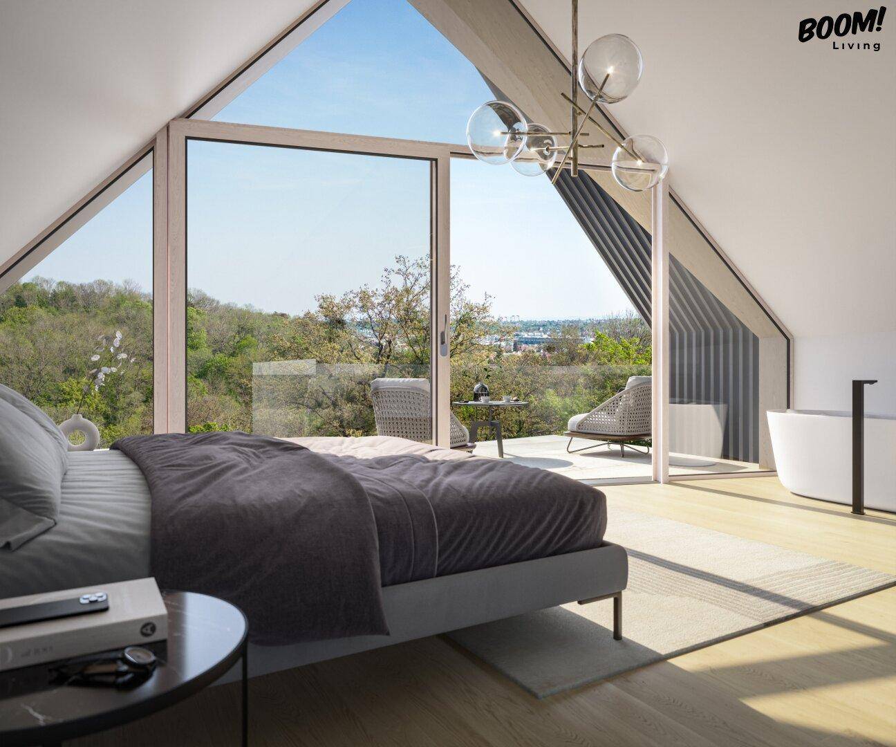 Helles Schlafzimmer im Dachgeschoss mit freistehender Badewanne, Holzboden und Panoramablick.