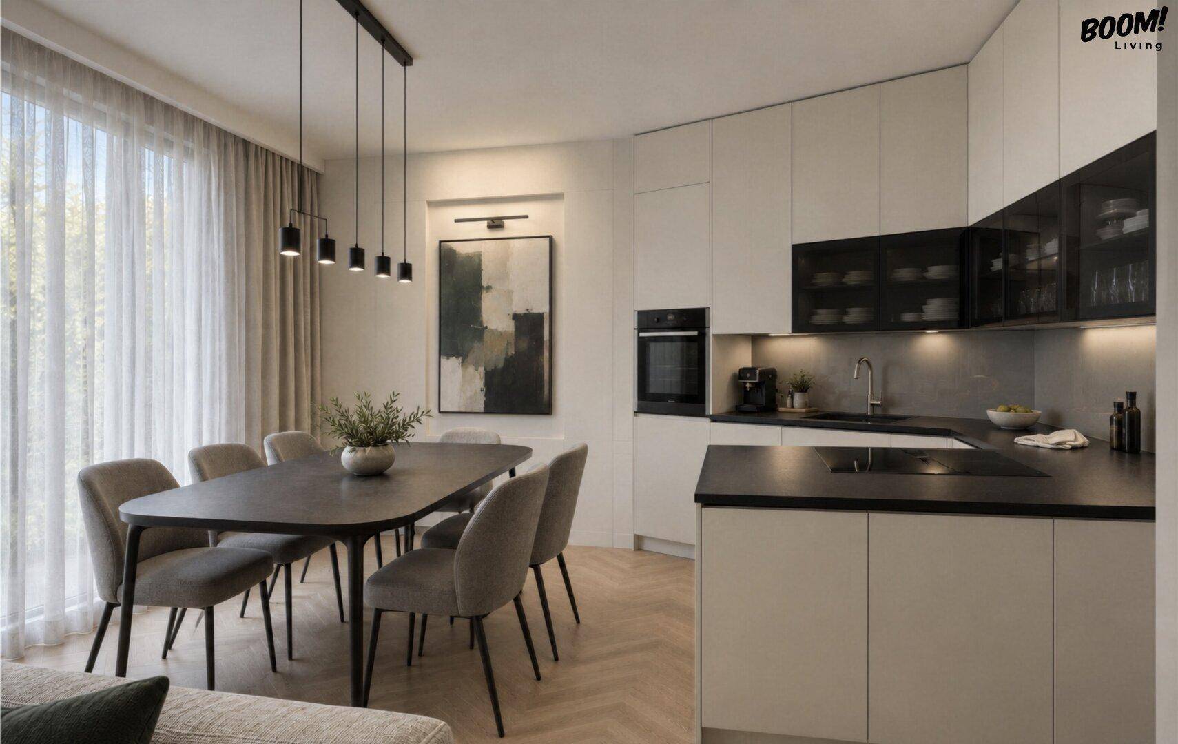 Moderne Einbauküche mit weißen Schränken, dunklen Arbeitsplatten und angrenzendem Essbereich.