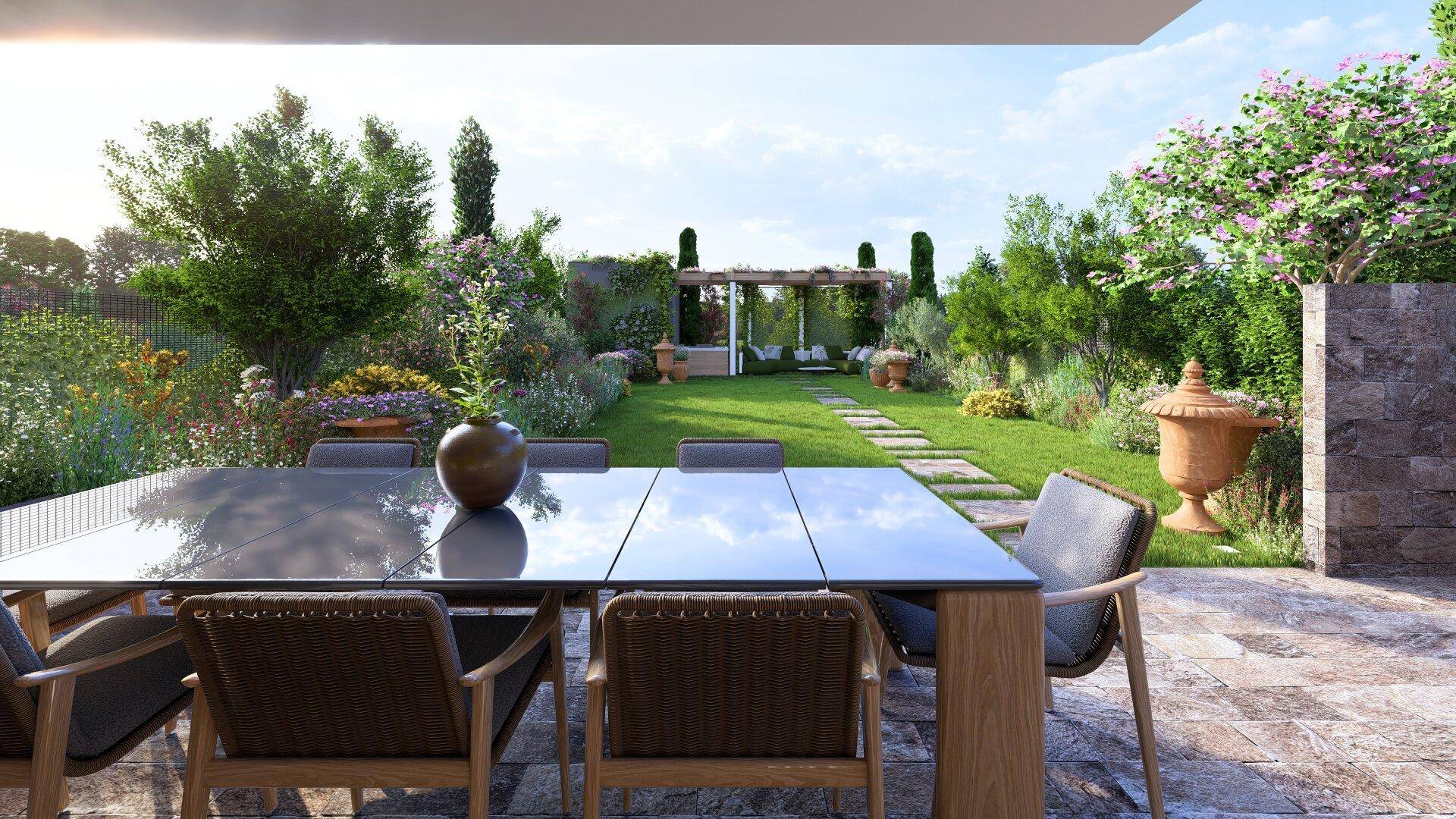 Gemütlicher Essbereich auf der Terrasse mit Blick auf den weitläufigen Garten und die Pergola.
