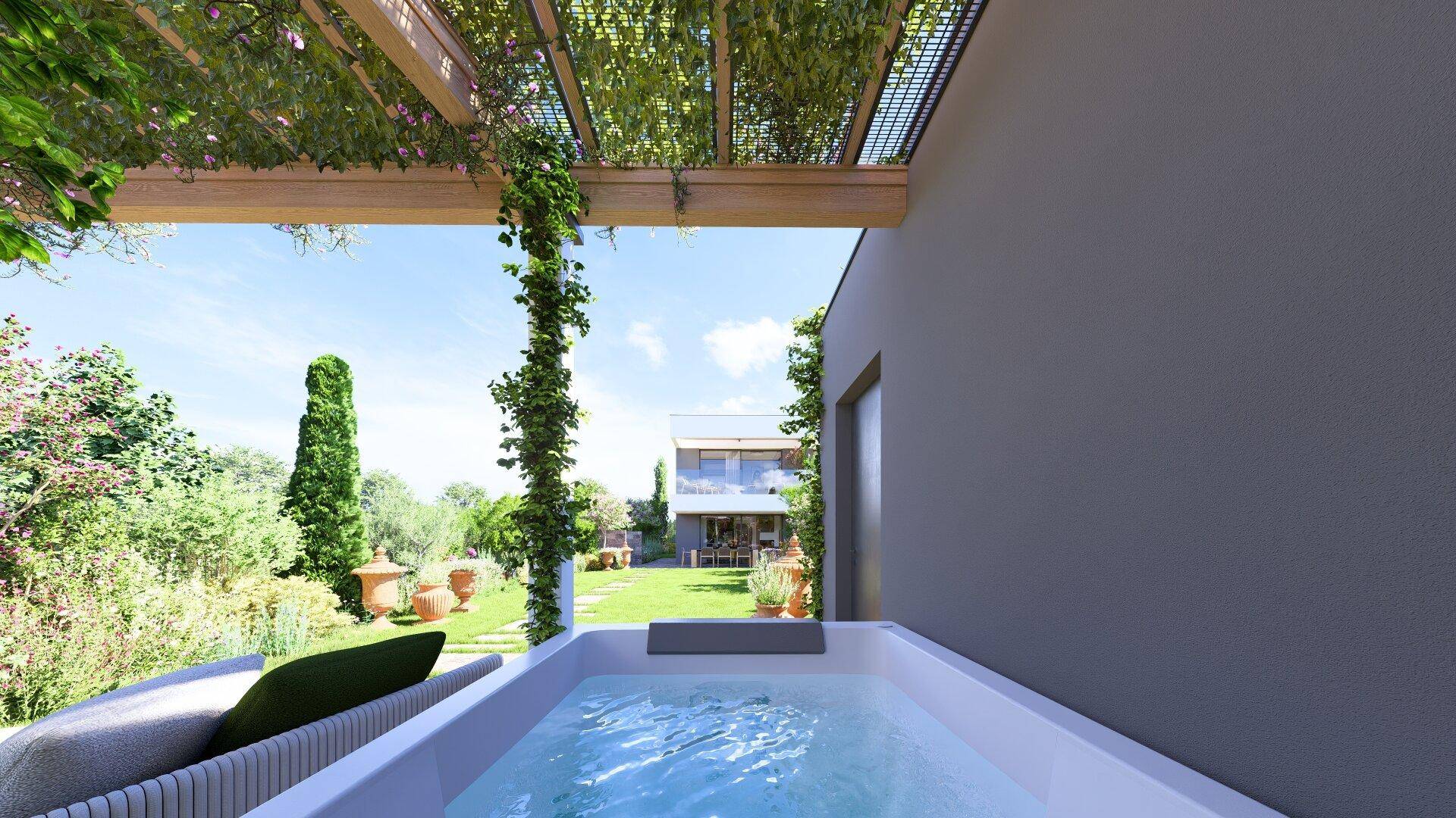 Entspannender Whirlpool unter einer begrünten Pergola mit Blick auf das Haus und den Garten.