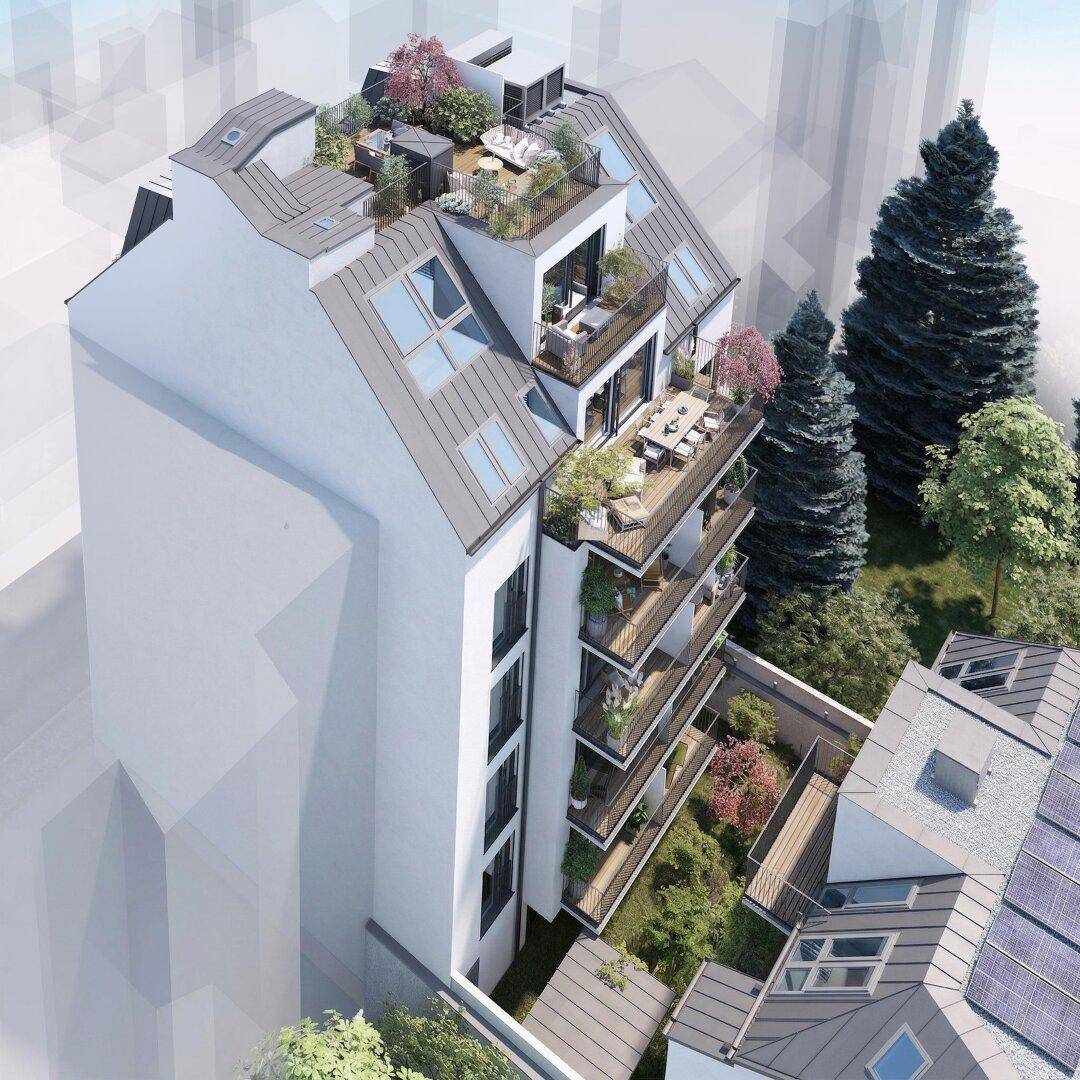 Luftaufnahme eines modernen Wohnkomplexes mit Dachterrassen und grünen Außenbereichen.