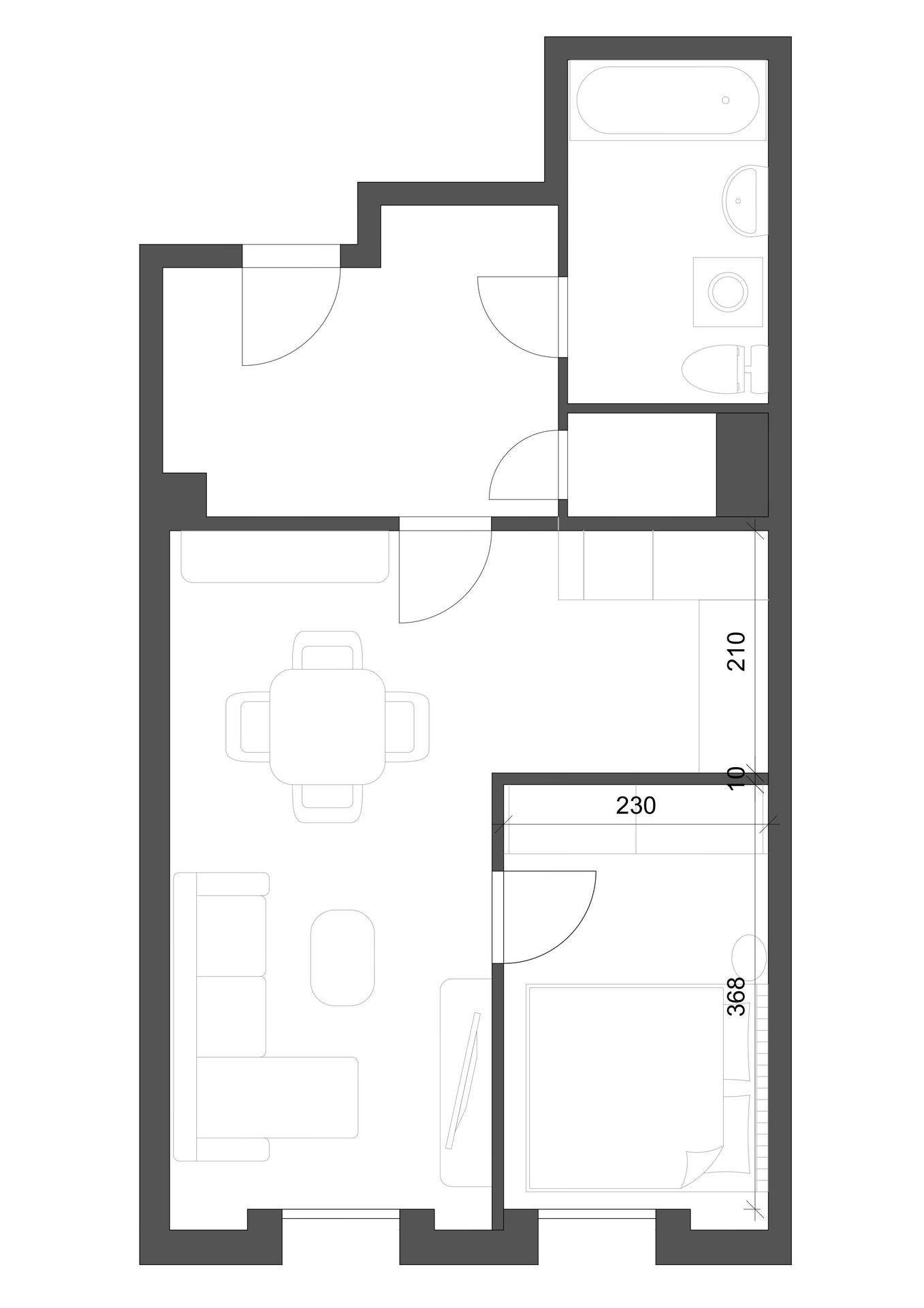 Grundrissplan einer Wohnung mit Wohnbereich, Schlafzimmer und Badezimmer.