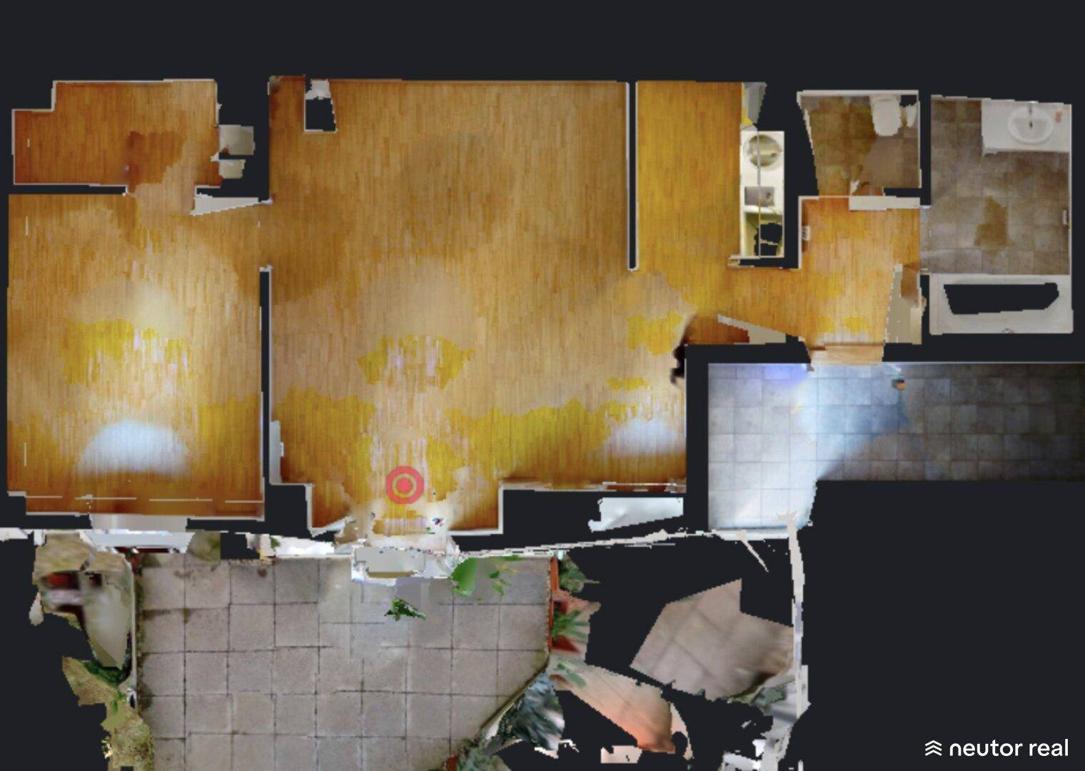 Grundriss einer Wohnung mit offenem Wohnbereich, Badezimmer und Zugang zu einem Außenbereich.