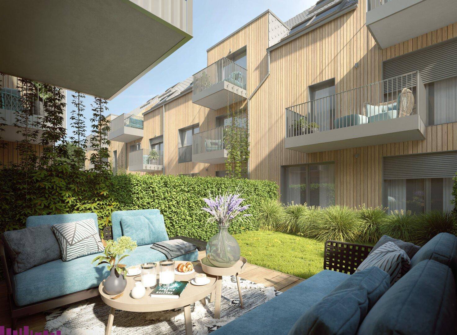Gemütliche Terrasse mit modernen Sitzmöbeln und Blick auf die begrünte Fassade der Wohnanlage.