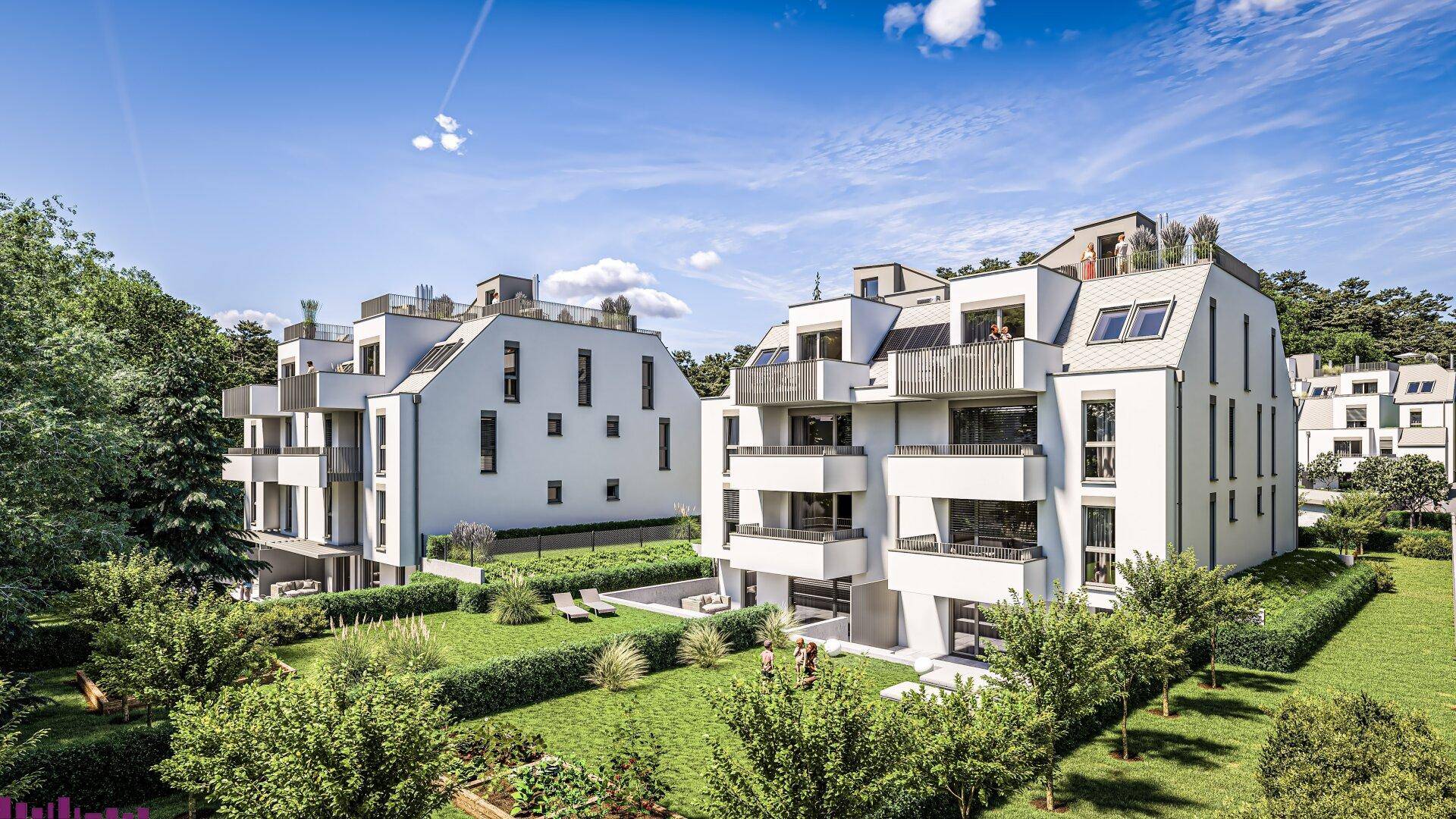 Moderne Wohngebäude mit ansprechender Architektur, Balkonen, Terrassen und gepflegten Grünflächen.