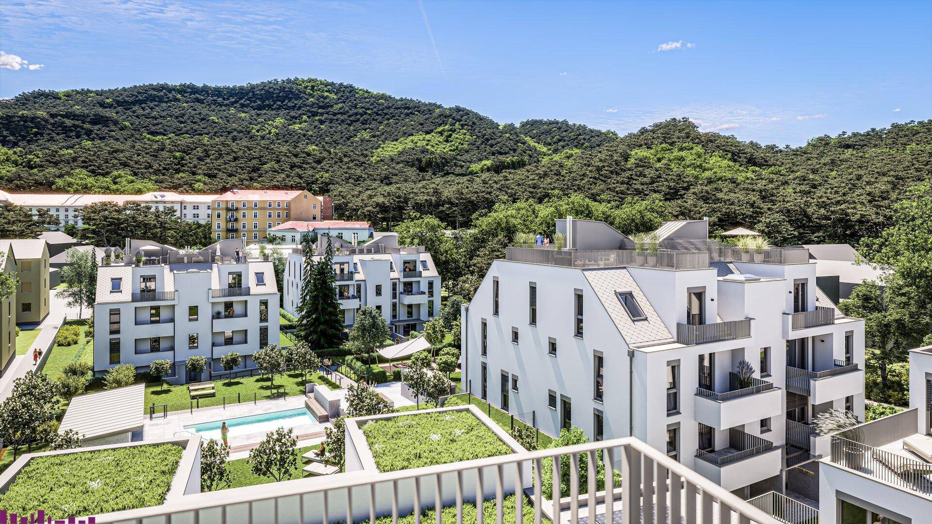 Luftaufnahme einer modernen Wohnanlage mit Pool und grüner Hügellandschaft im Hintergrund.