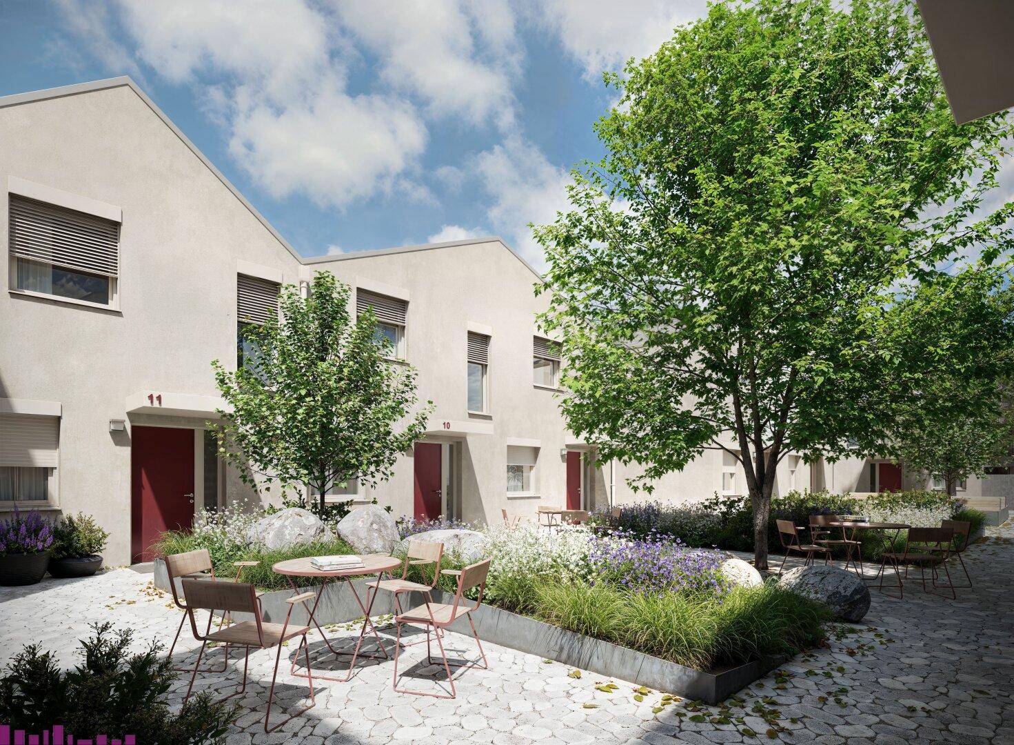 Begrünter Innenhof mit Sitzgelegenheiten und dekorativen Pflanzen zwischen modernen Gebäuden.
