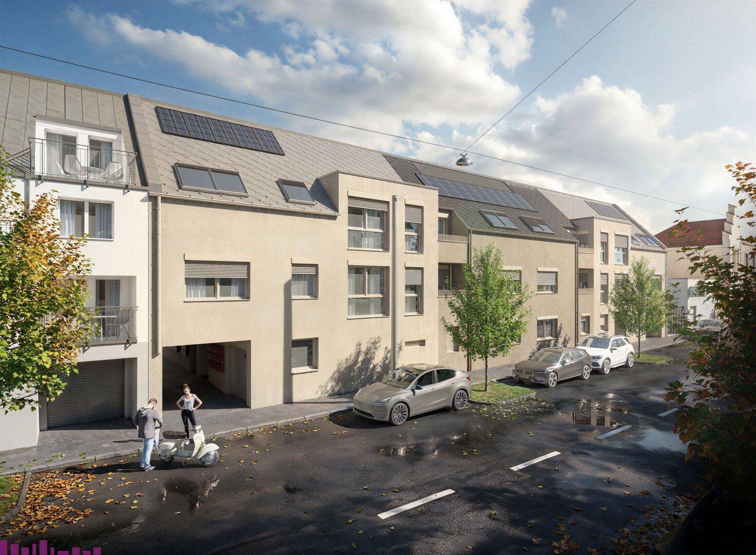 Moderne Wohngebäude mit Photovoltaikanlage auf dem Dach und Parkplätzen an der Straße.