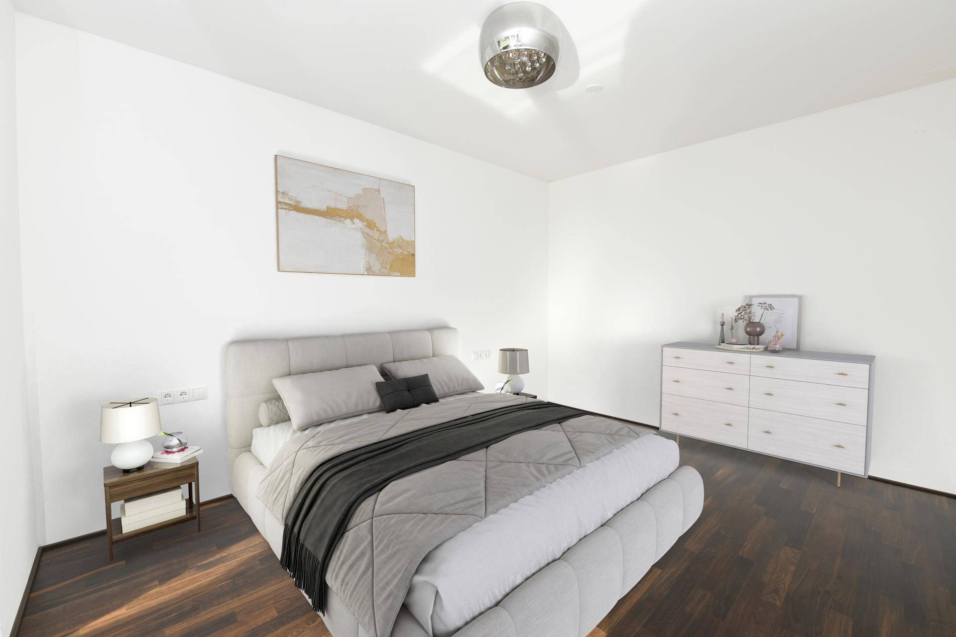 Helles Schlafzimmer mit dunklem Holzboden und moderner Einrichtung.