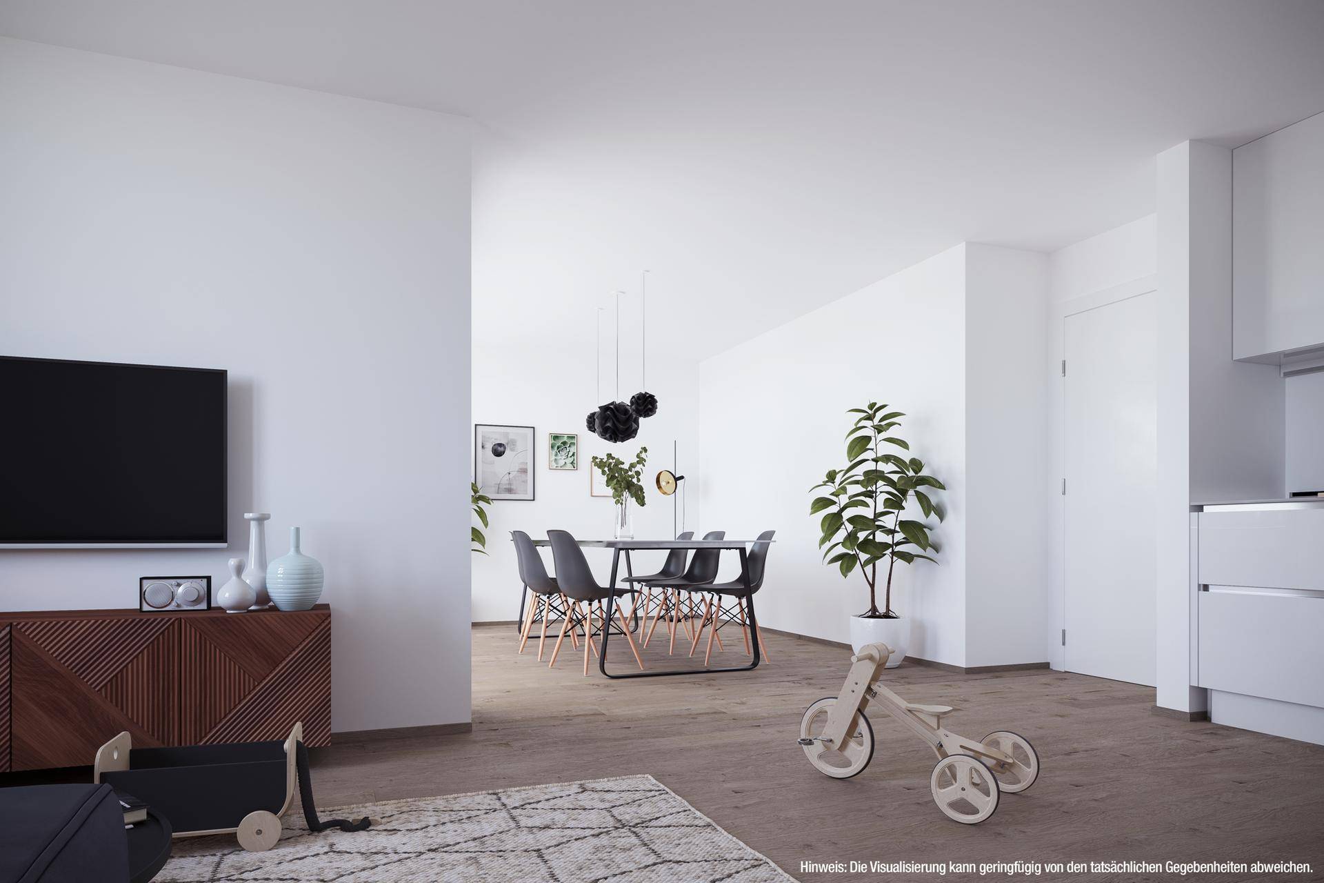 Heller Wohn- und Essbereich mit Holzboden, weiß gestrichenen Wänden und moderner Einrichtung.