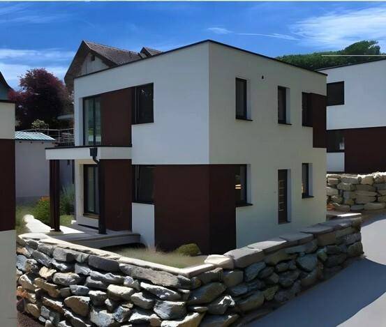Modernes Haus mit weißer und brauner Fassade, umgeben von einer Steinmauer.