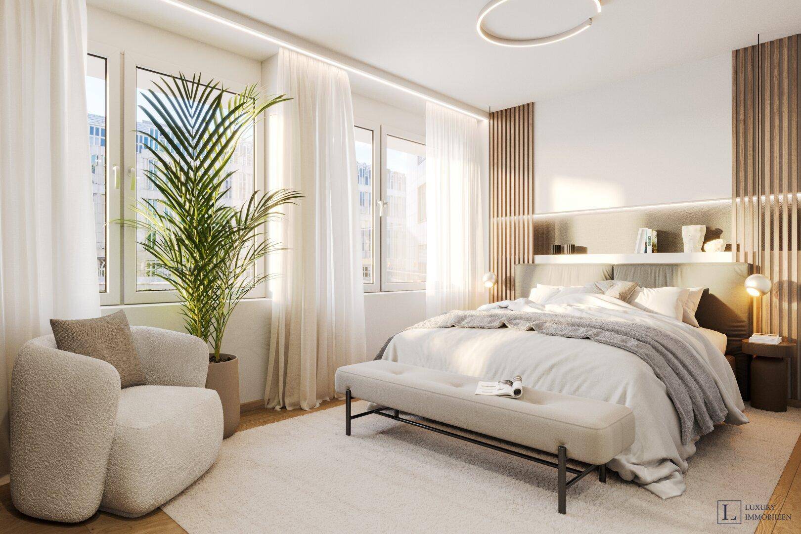 Helles Schlafzimmer mit großem Doppelbett, bequemen Sessel und viel Tageslicht.