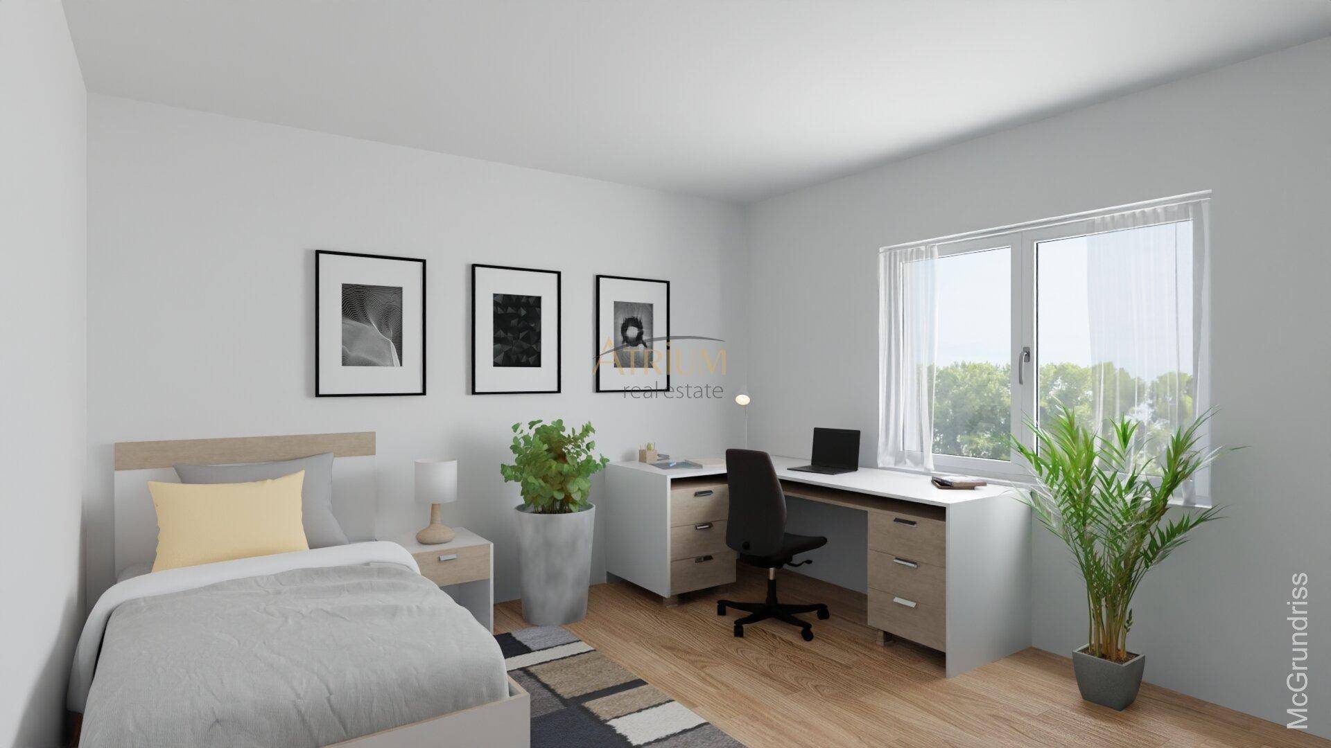 Gemütliches Schlafzimmer mit Einzelbett, Schreibtisch und Blick ins Grüne.