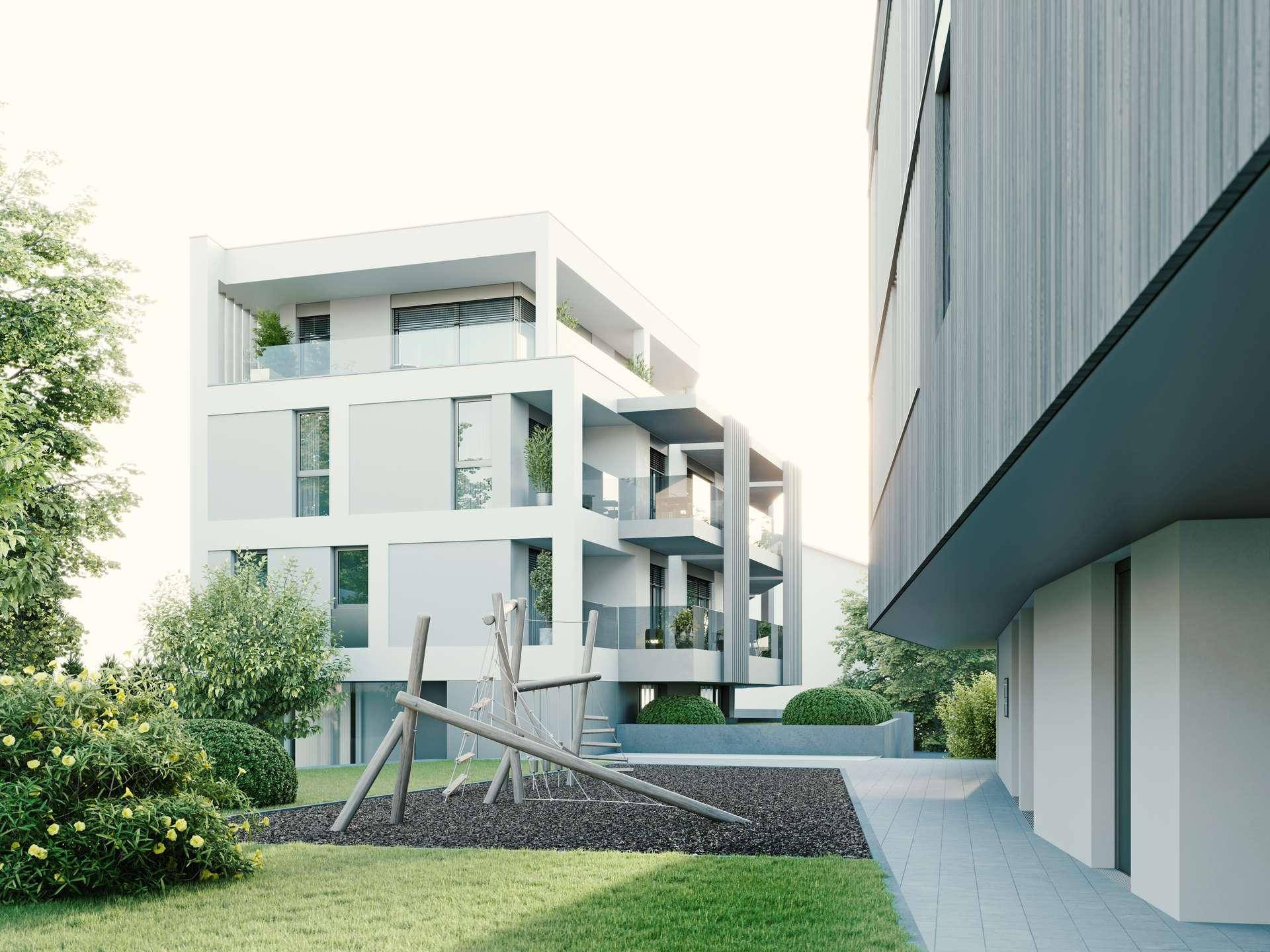 Moderne Wohnanlage mit Spielplatz, Balkonen und gepflegten Grünflächen im Außenbereich.