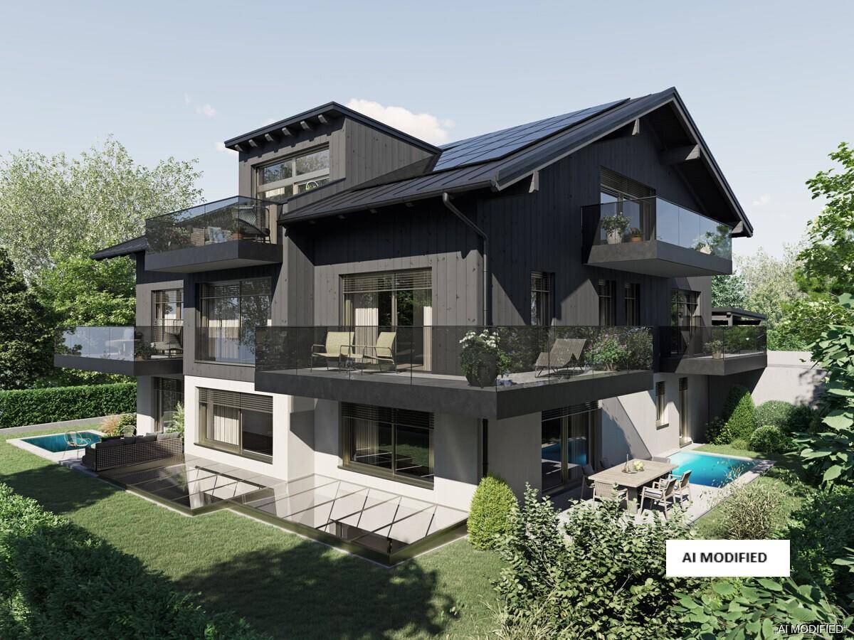 Großzügiges modernes Haus mit mehreren Balkonen, Terrasse, Pool und weitläufigem Gartenbereich.