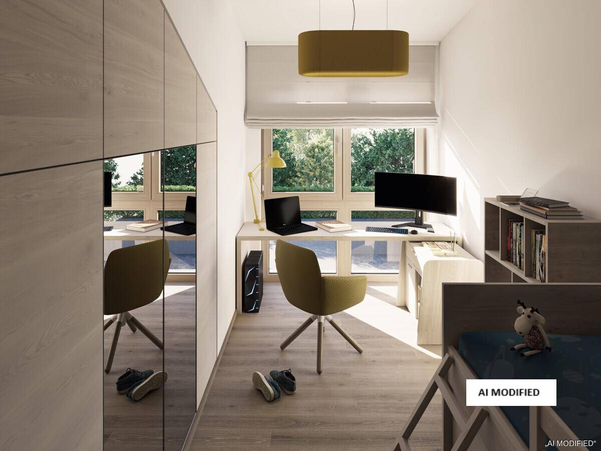 Kinderzimmer oder Arbeitszimmer mit Schreibtisch, Computer und praktischem Spiegelschrank.