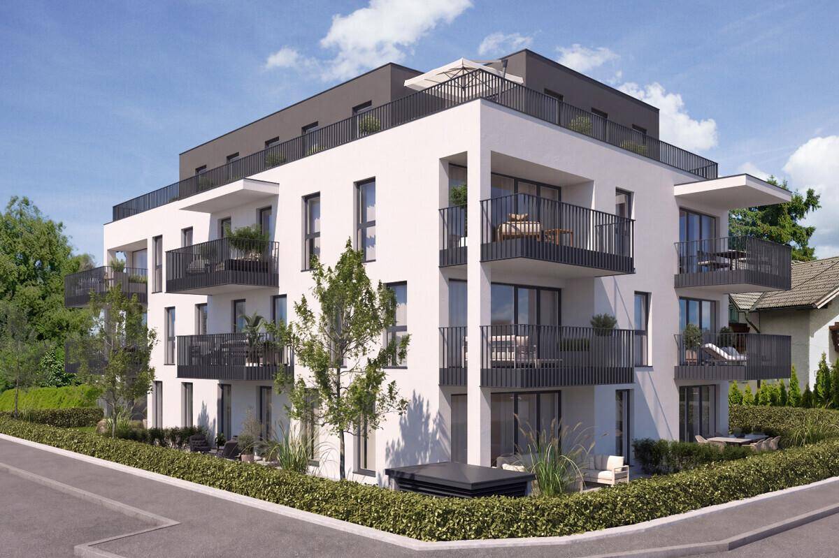 Architektonisch ansprechendes Mehrfamilienhaus mit großzügigen Balkonen und Terrassen.