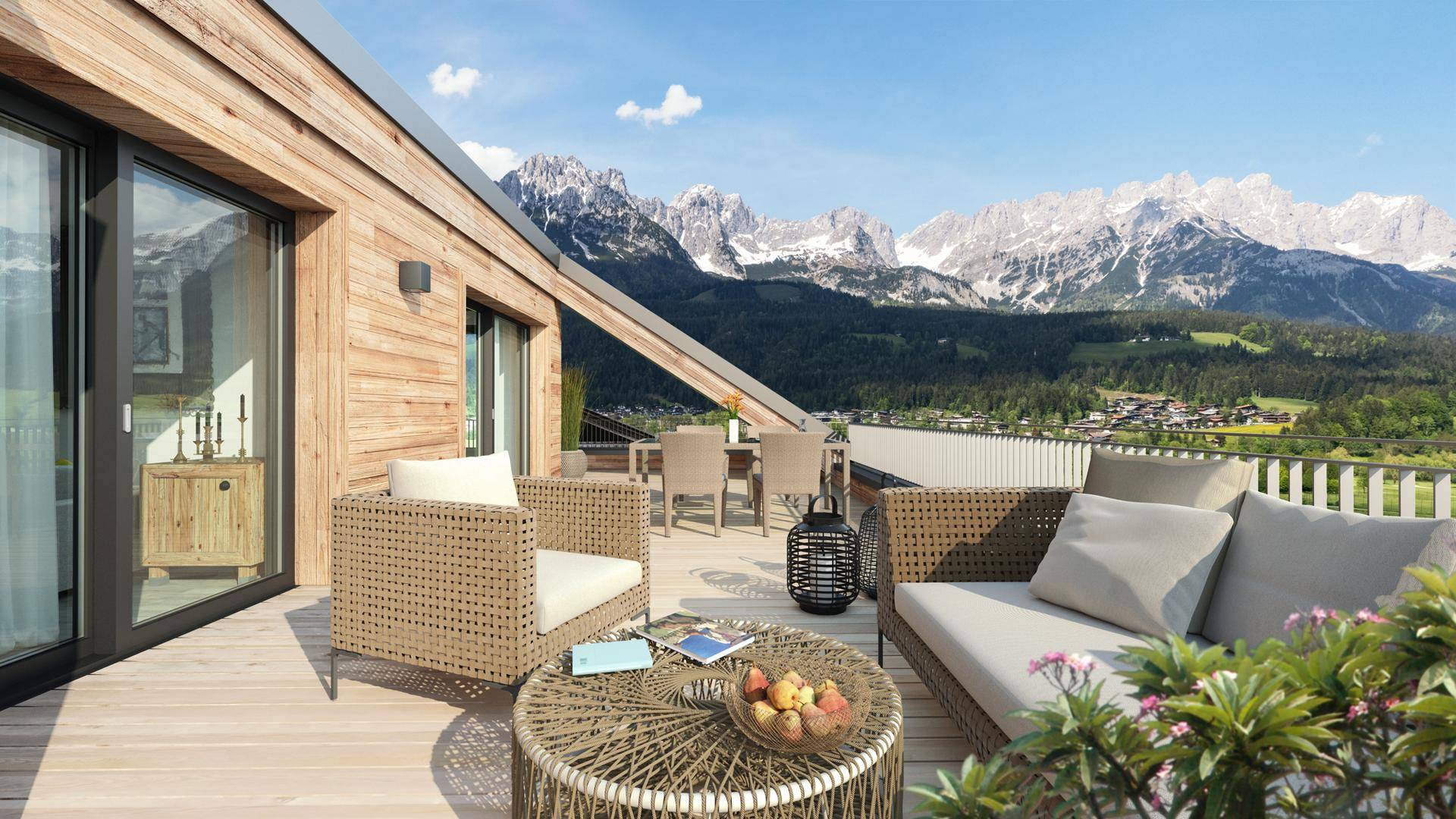 Geräumige Dachterrasse mit modernen Outdoor-Möbeln und spektakulärem Panoramablick auf die umliegende Bergwelt.