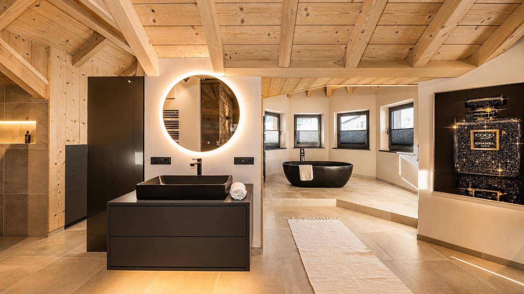 Modernes Badezimmer im Dachgeschoss mit freistehender Badewanne und stilvollem Waschtisch.