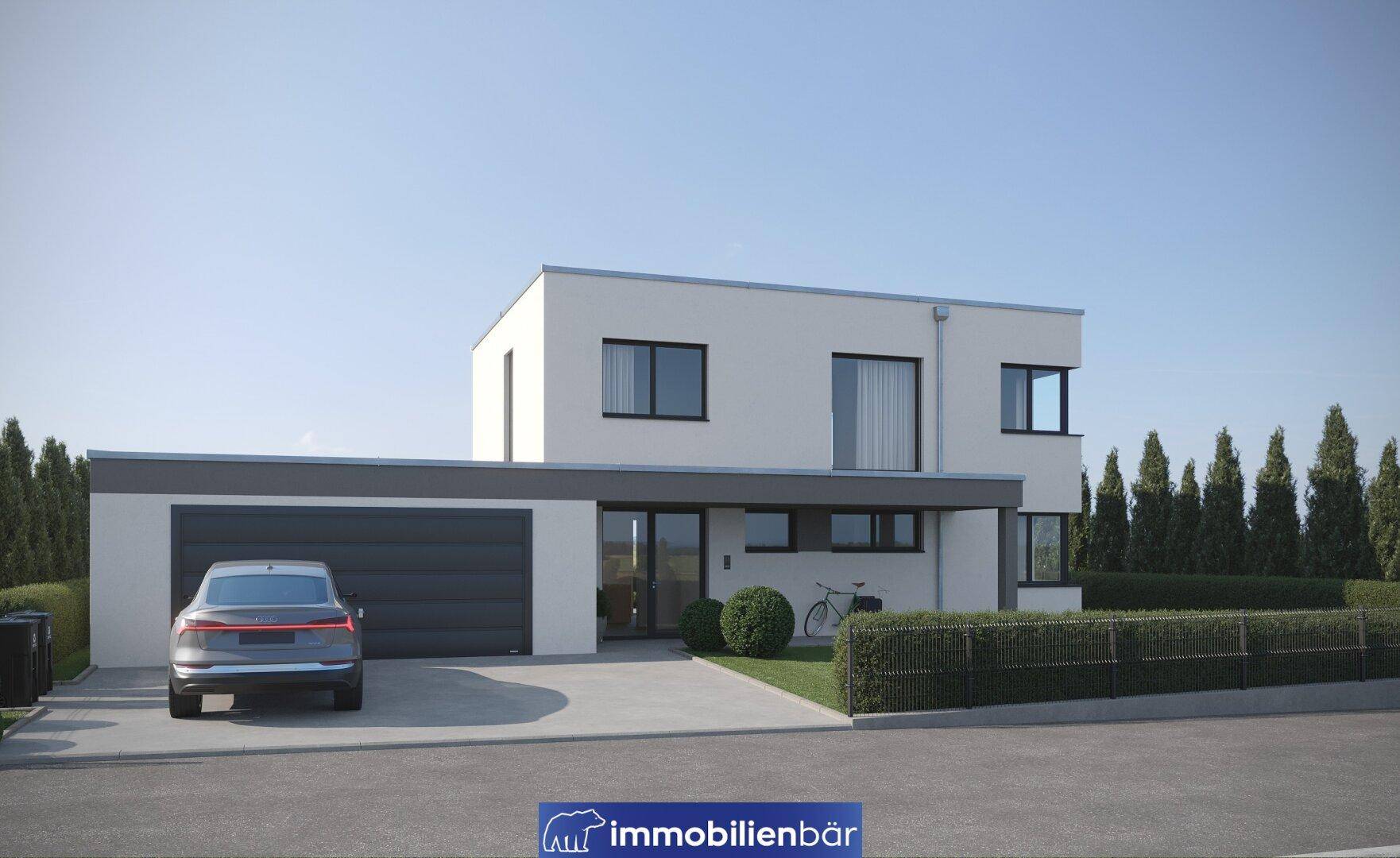 Vorderansicht eines modernen Hauses mit integrierter Garage und gepflegter Auffahrt.